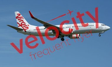 Virgin Australia plane in the sky with Velocity watermark