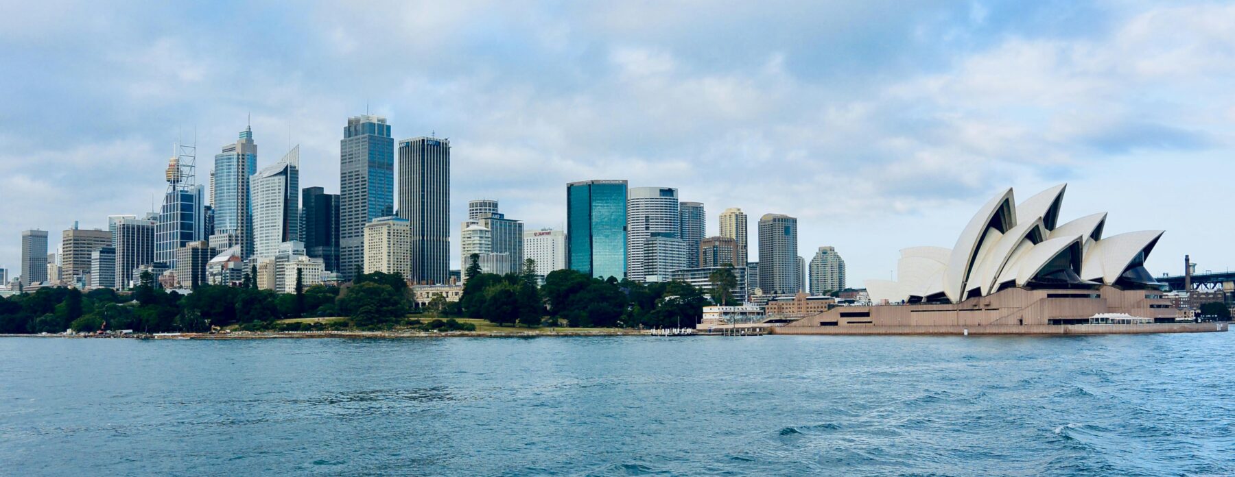 Sydney Opera House and Sydney skyline along the harbour.